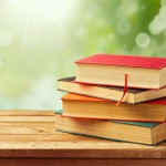 Old vintage books over beautiful bokeh background